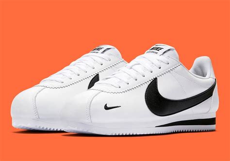 black nike shoes white swoosh.